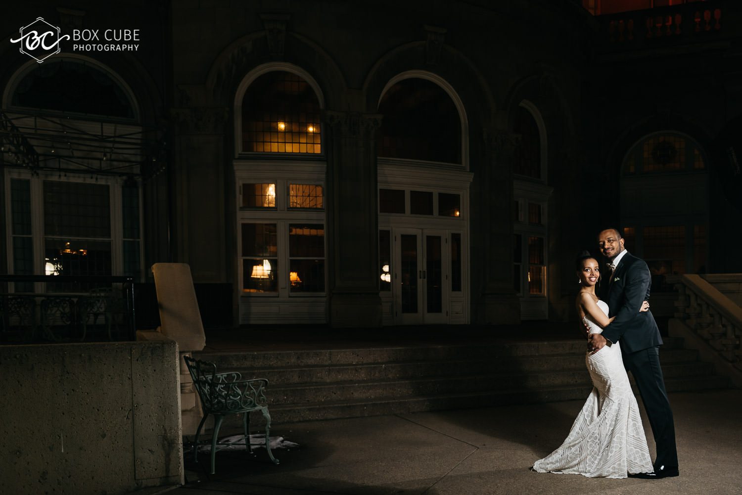 photo of bride and groom overlooking edmonton downtown from hotel fairmont macdonald balcony