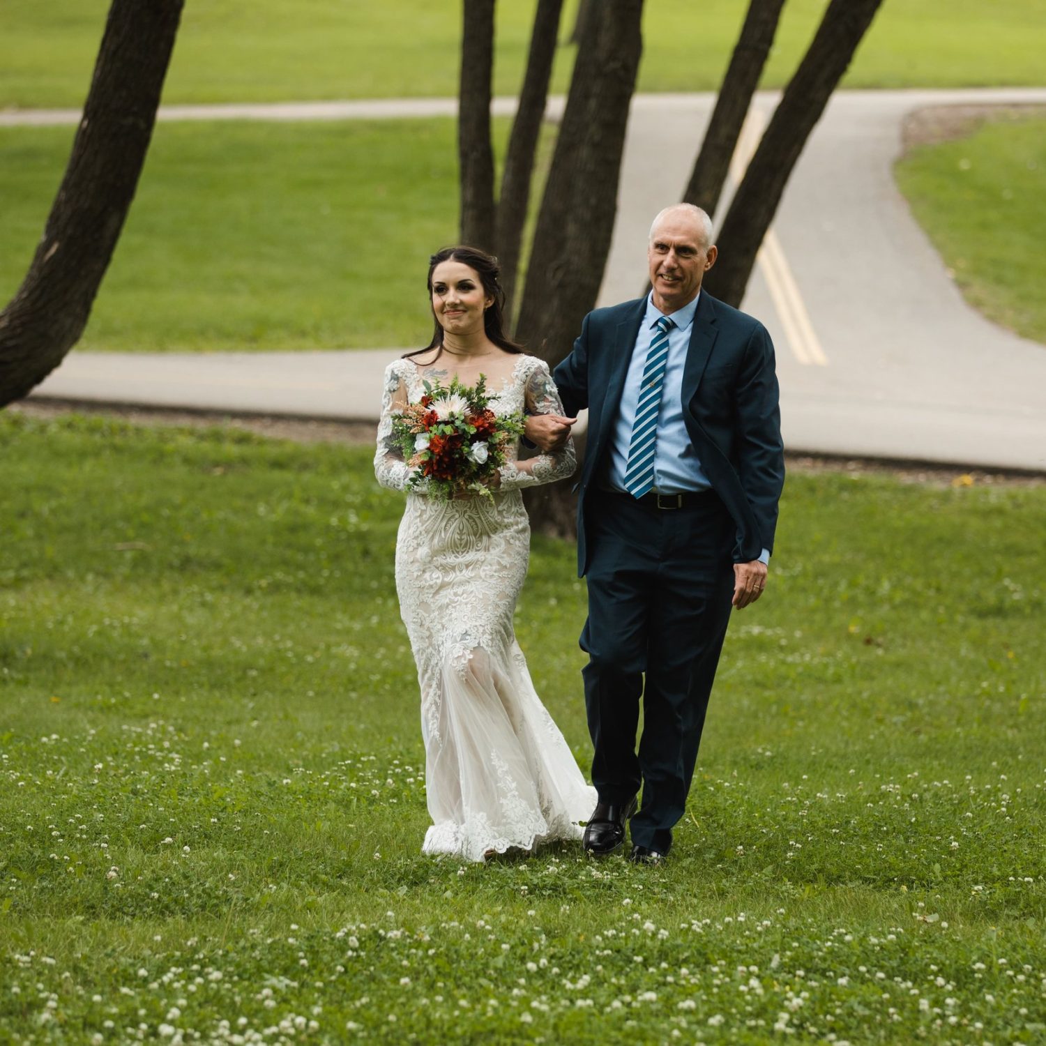 couples posing at Confederation Park, a top-rated Calgary photoshoot location for fall wedding sessions.